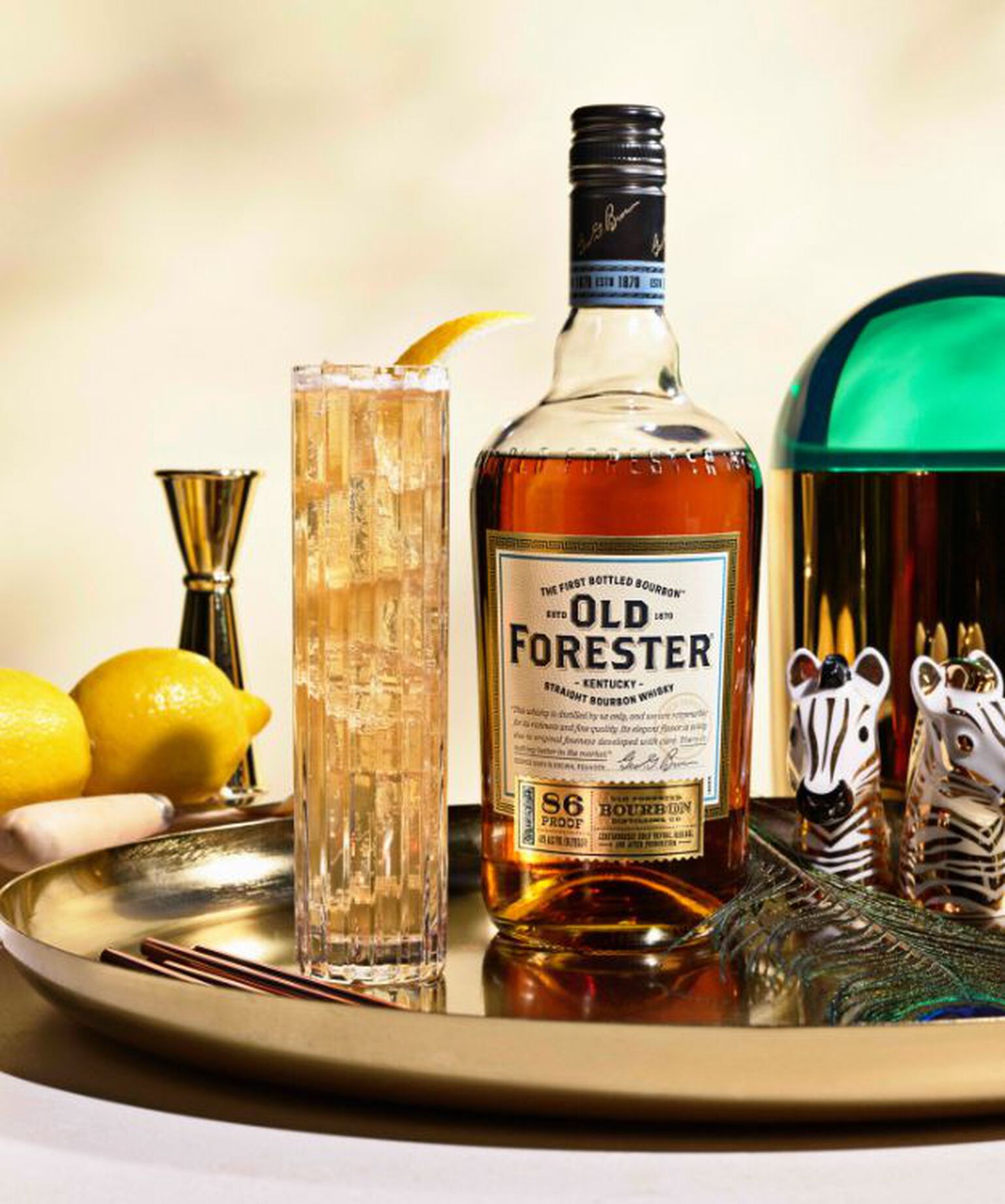 A bottle of Old Forester with a cocktail